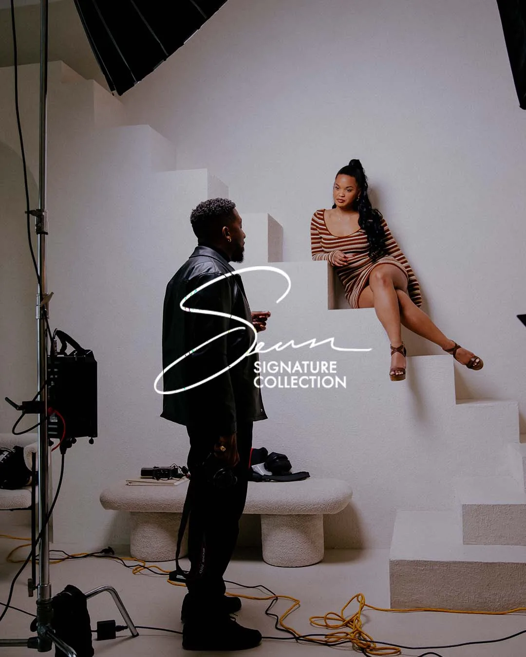 Sean Diamond directing a portrait shoot, with The Sean Signature Collection logo