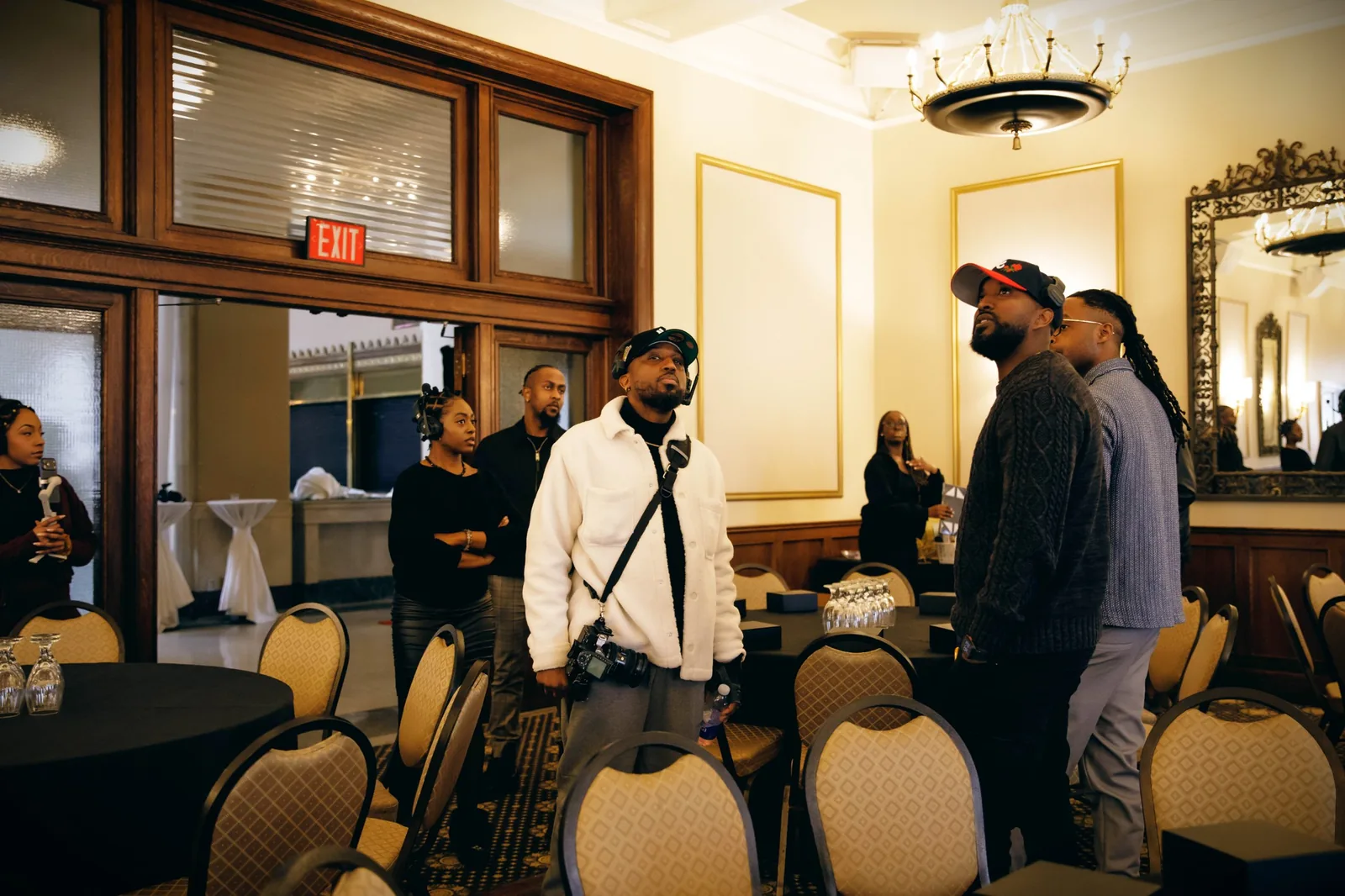 Sean Diamond walking the venue with the event team before the room is set, planning shots